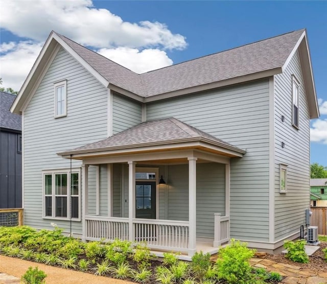 267 E 11th St, Fayetteville, AR 72701 - view of front of home with covered porch, central AC, and a shingled roof