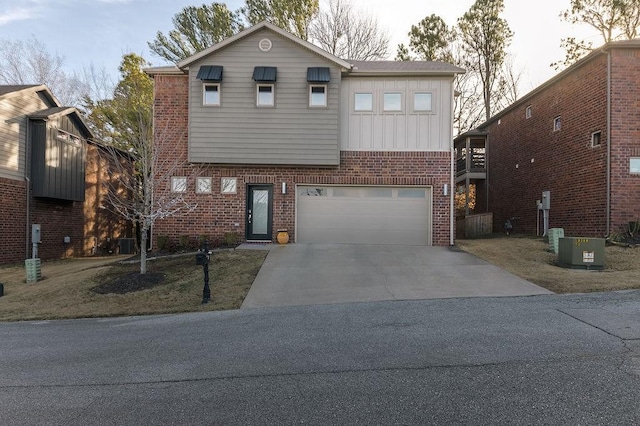 view of front facade featuring a garage and cooling unit