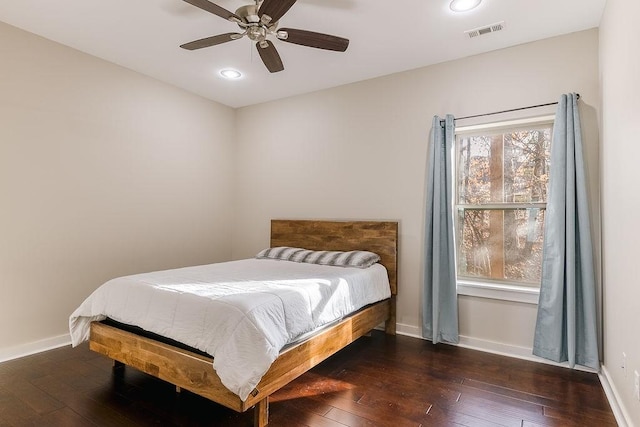 bedroom with dark wood-type flooring and ceiling fan