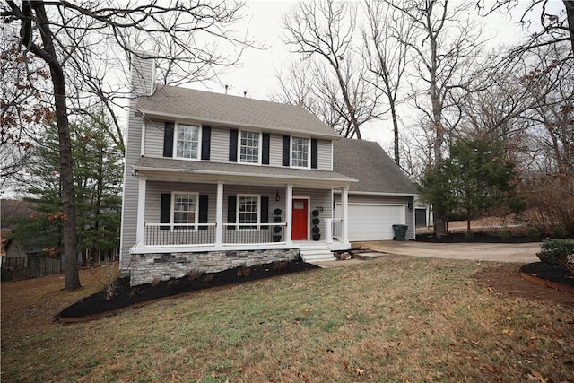 colonial-style house with a garage, a front yard, and covered porch