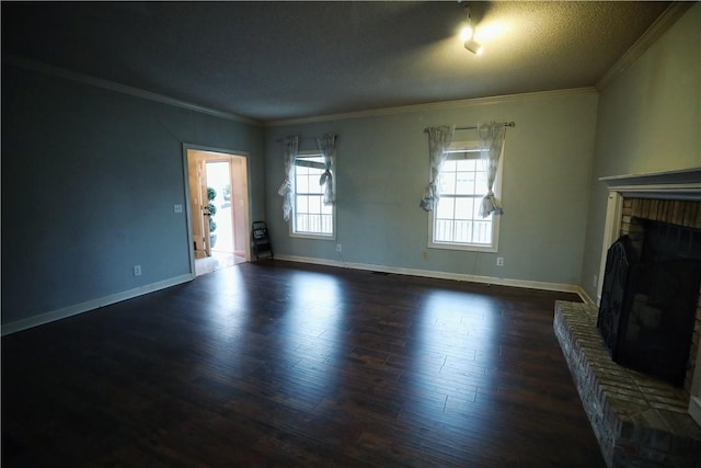 unfurnished living room featuring crown molding, a brick fireplace, a textured ceiling, and dark hardwood / wood-style flooring