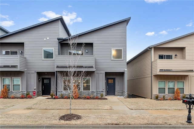 view of front of property featuring stone siding and board and batten siding