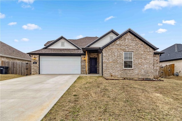 view of front of home with a garage and a front lawn