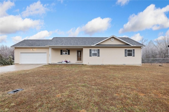 ranch-style house featuring a garage and a front lawn