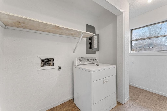 laundry area featuring electric panel, washer / dryer, and a textured ceiling