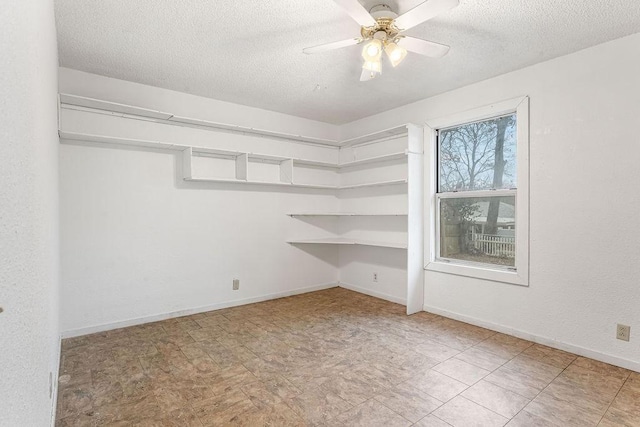 spacious closet with ceiling fan