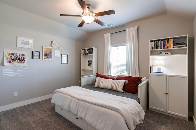 bedroom with a ceiling fan, visible vents, vaulted ceiling, baseboards, and dark colored carpet