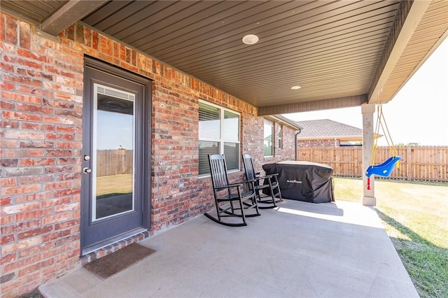 view of patio / terrace featuring fence