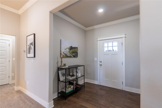 foyer with baseboards, dark wood finished floors, and crown molding