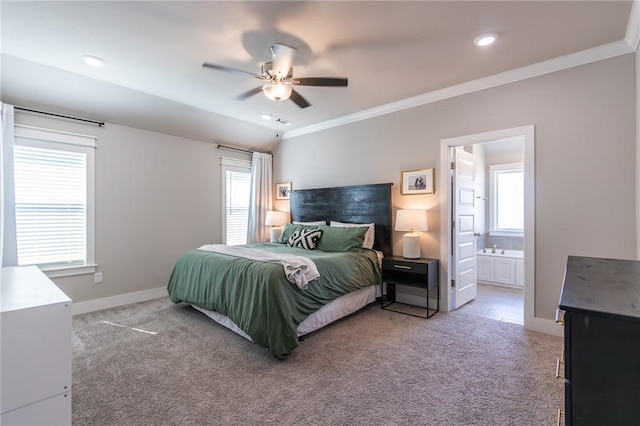 bedroom featuring connected bathroom, recessed lighting, light carpet, baseboards, and crown molding