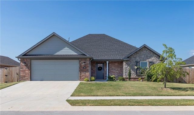 view of front of house featuring a garage, brick siding, fence, concrete driveway, and a front yard