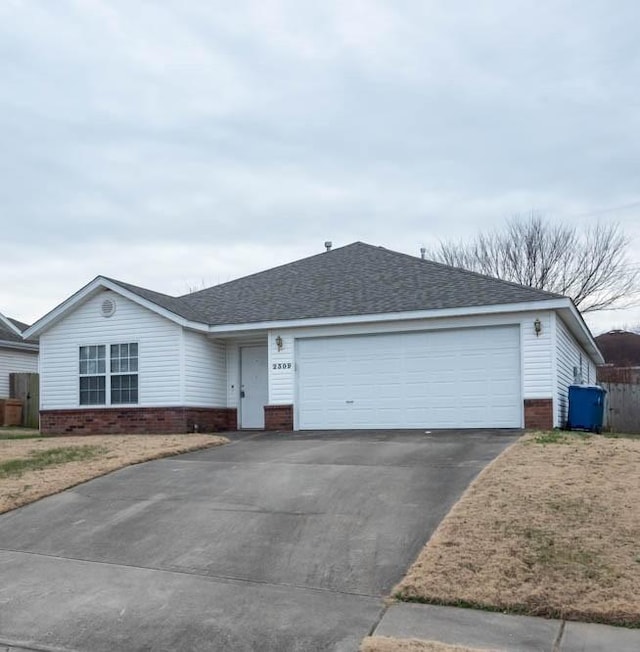 single story home featuring a garage