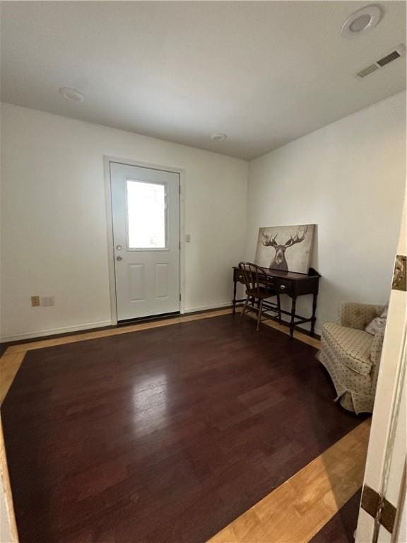 entryway with hardwood / wood-style floors