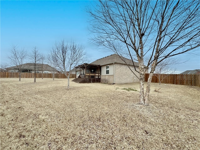 view of yard with a fenced backyard