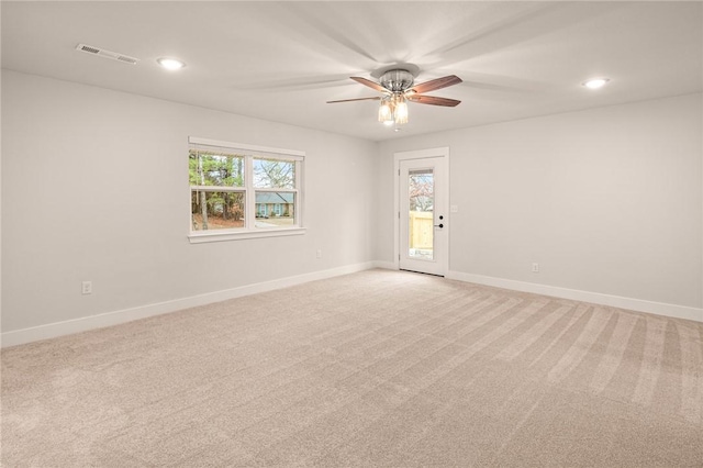 carpeted empty room featuring ceiling fan