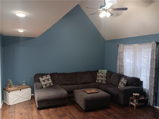 living room featuring ceiling fan, dark hardwood / wood-style floors, and vaulted ceiling