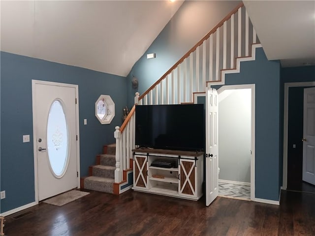 entrance foyer with lofted ceiling and hardwood / wood-style floors