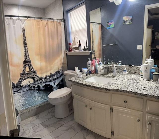 bathroom with vanity and toilet