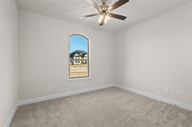 unfurnished room with light carpet and ceiling fan