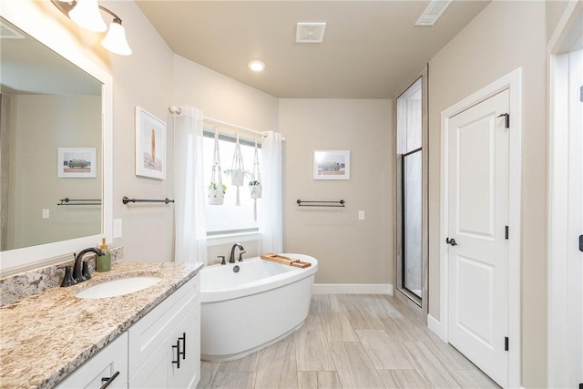 bathroom with vanity and plus walk in shower