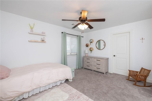 bedroom featuring light colored carpet and ceiling fan