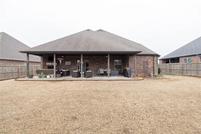 rear view of property featuring a patio area