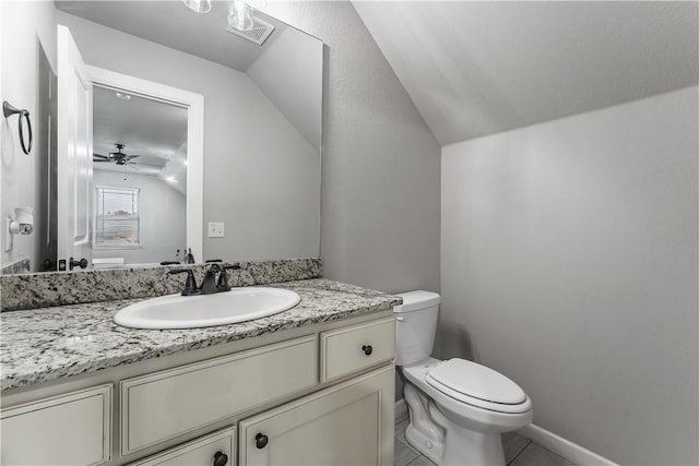 bathroom featuring vanity, lofted ceiling, ceiling fan, and toilet