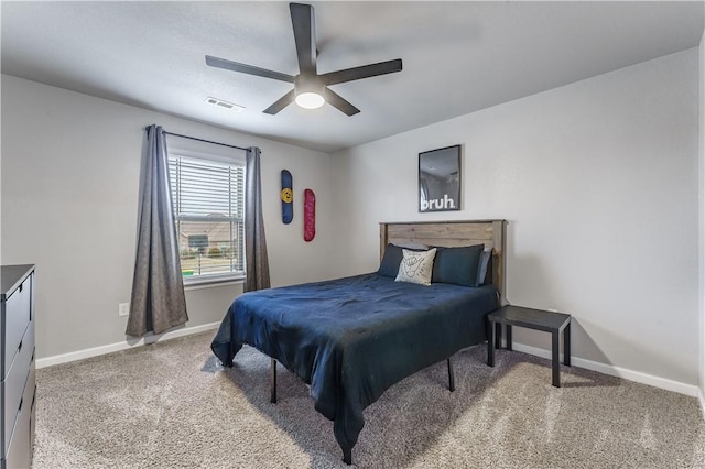 bedroom featuring ceiling fan and carpet