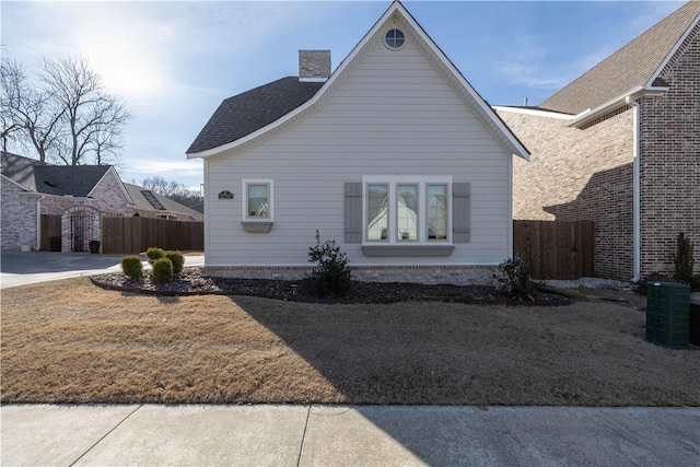 view of side of property with a lawn