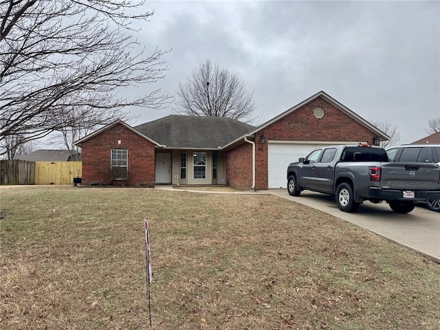 single story home with a garage and a front lawn