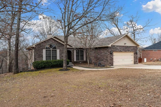 single story home featuring a garage and a front yard