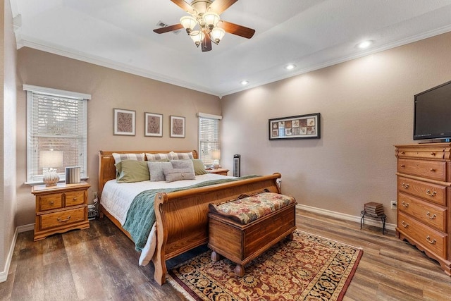 bedroom with dark wood-type flooring, ceiling fan, and crown molding