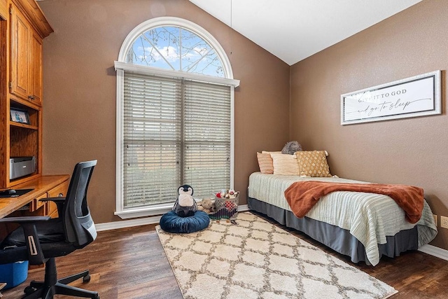 bedroom with lofted ceiling and dark hardwood / wood-style flooring