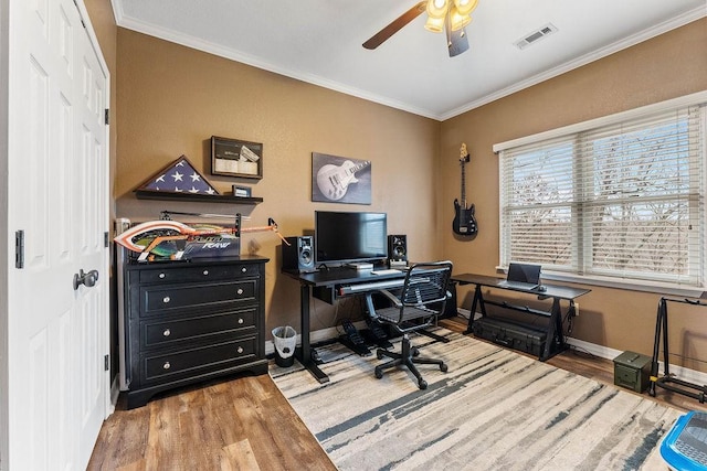 office with ornamental molding, ceiling fan, and light hardwood / wood-style floors