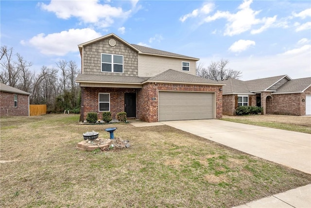 traditional-style home with brick siding, a shingled roof, a front yard, a garage, and driveway