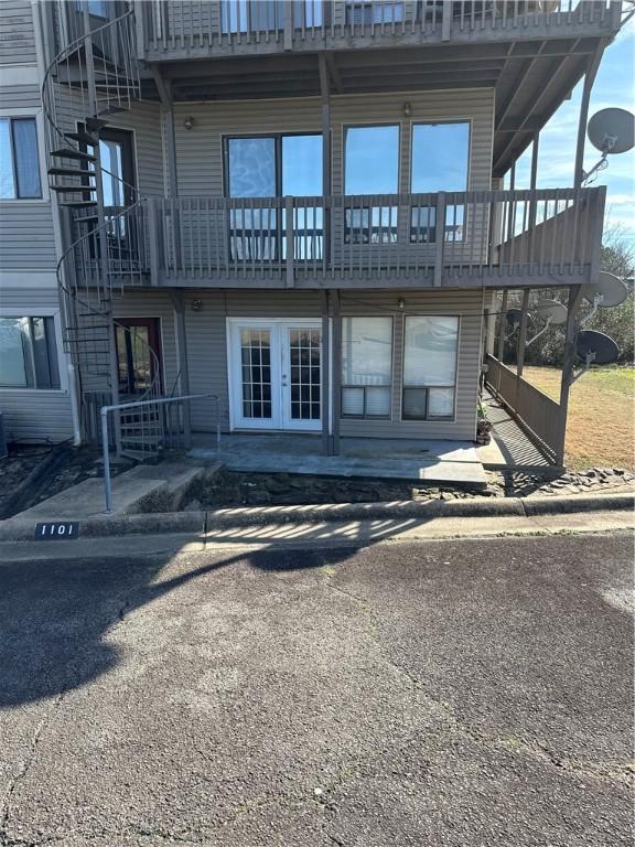 rear view of property with a patio and french doors