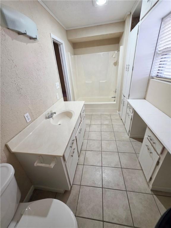 full bathroom with bathtub / shower combination, tile patterned floors, vanity, and toilet