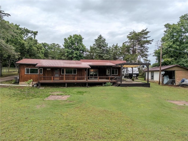 19724 Waldon Rd, Rogers, AR 72756 - back of property with a yard, a porch, metal roof, and central AC unit
