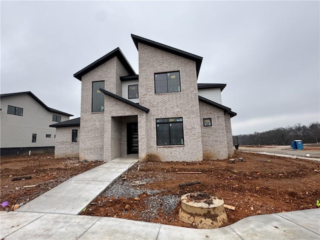 view of front of house with an outdoor fire pit