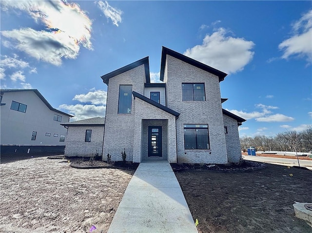 view of front of house with brick siding