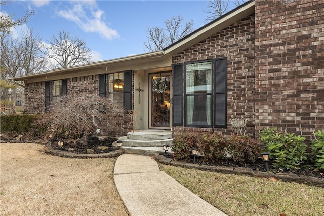 entrance to property with a yard