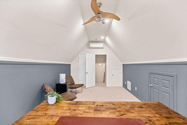additional living space with vaulted ceiling, a ceiling fan, carpet, and a wall unit AC