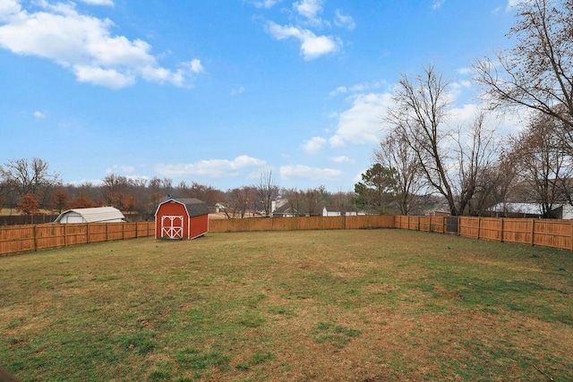 view of yard featuring a shed and an outdoor structure