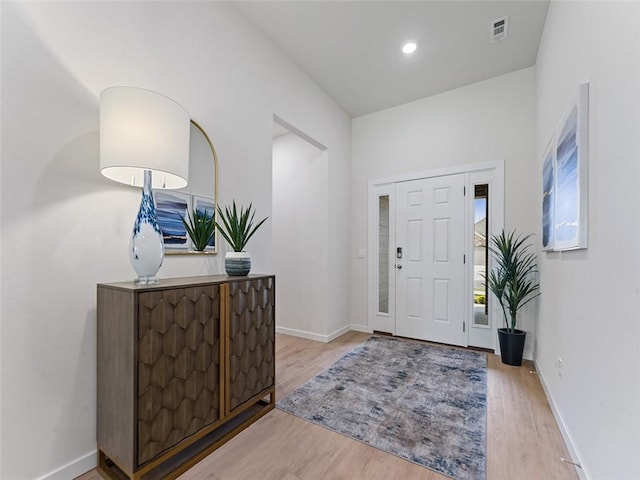 foyer with light hardwood / wood-style floors