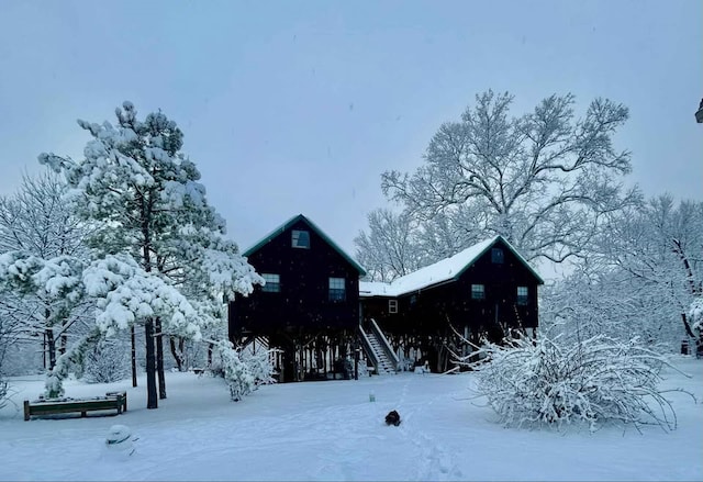 view of snow covered house