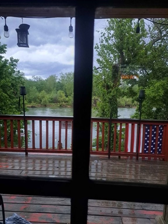 wooden deck with a water view