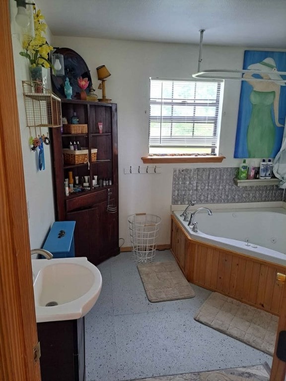 bathroom featuring sink and a bathing tub