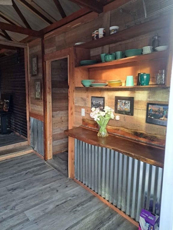 interior space featuring hardwood / wood-style flooring and wood walls