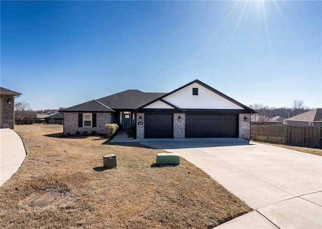 single story home with a garage and a front yard