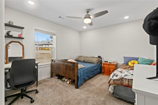 bedroom featuring light carpet and ceiling fan